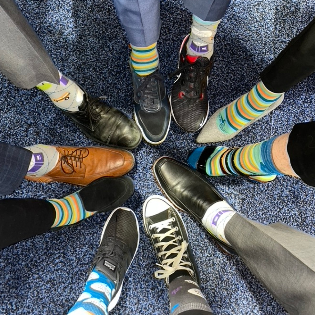 Top view of group of shoes and multicolor socks