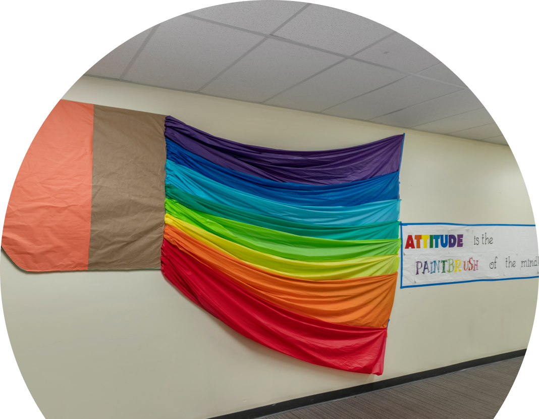 Pride and inclusion flag on wall