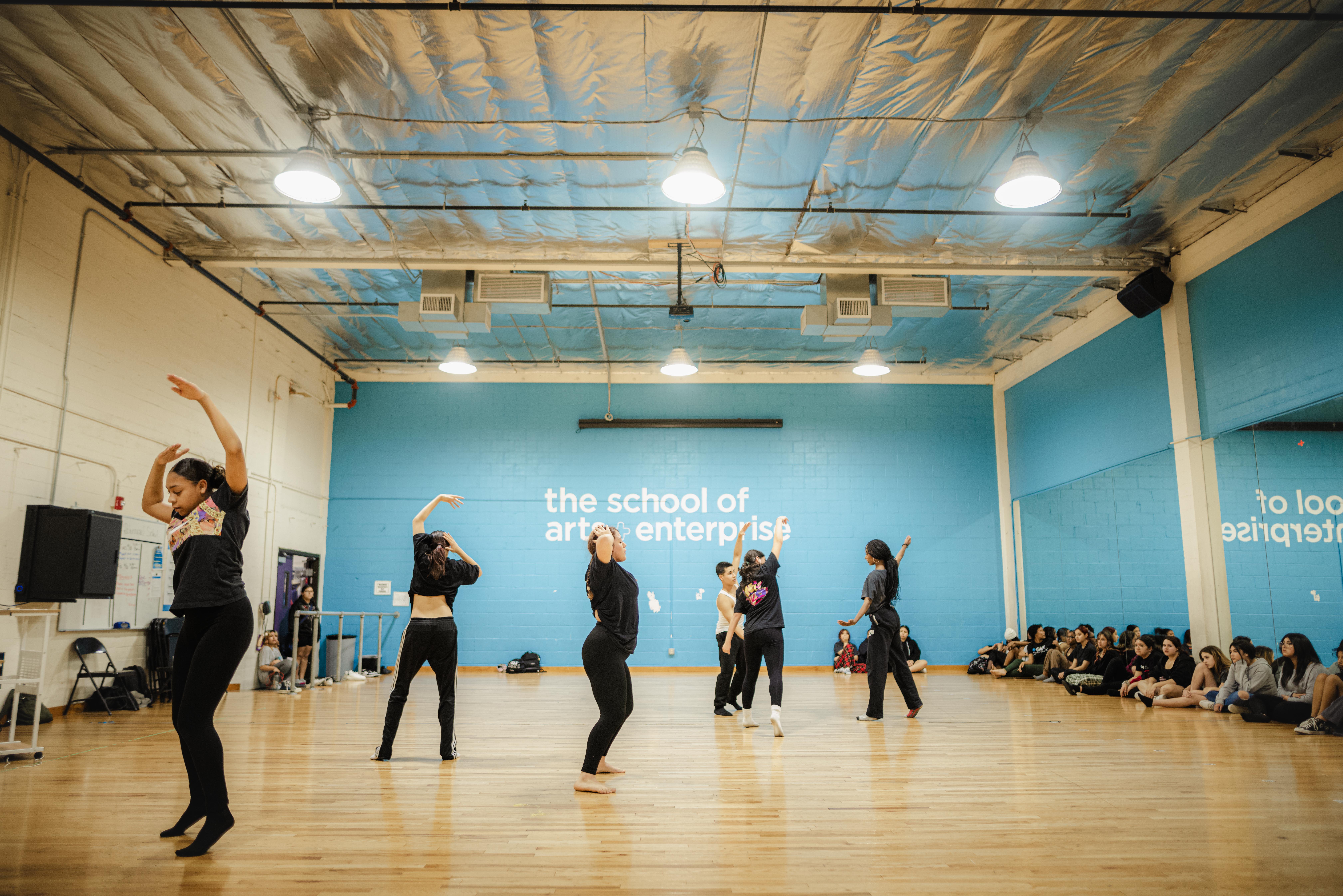 Kids dancing at the SAE