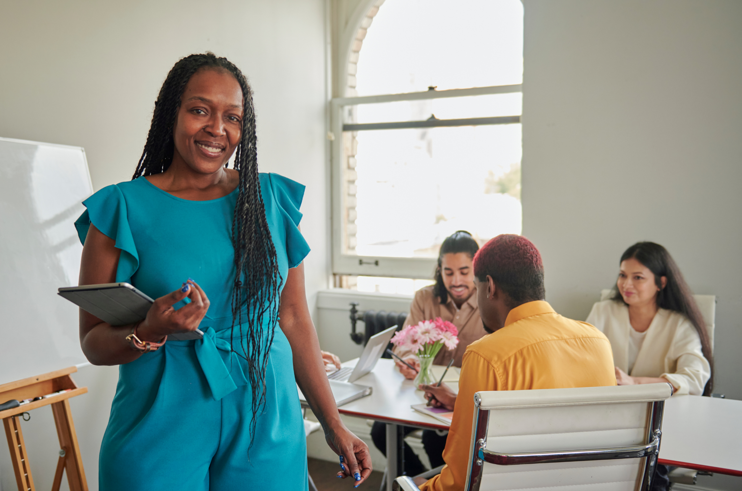 Diverse charter school board members collaborating around a conference table